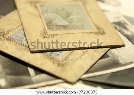 Stack of old photographs, selective focus