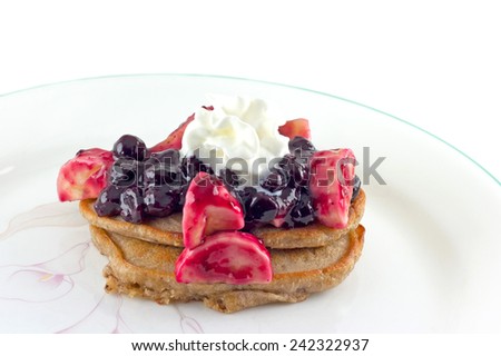 Pancakes with fresh blueberry and banana sauce.