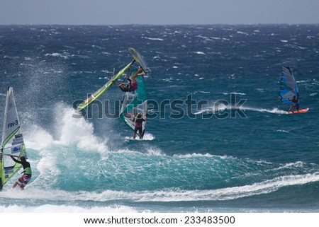 MAUI, HAWAII, USA - APRIL 2009: Serious air time. Extreme Windsurfing on Maui's famous Ho'okipa Beach, located on the windy North Shore.