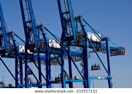PITT MEADOWS, BC, CANADA - SEPT 2009: Giant cargo cranes lined up along the Fraser River, Surrey / Delta, BC