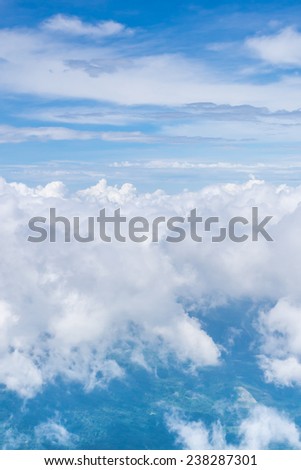 white cloud ,clear blue sky and green earth view from airplane