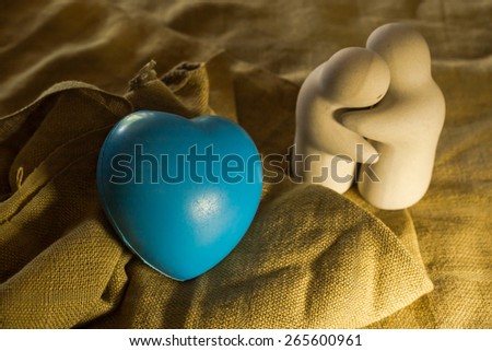 still life with love twin doll and blue heart