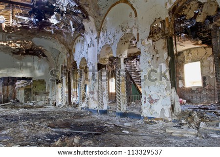 Abandoned music theater ballroom in Detroit Michigan. It has burned and it\'s once beautiful facade is crumbling away.