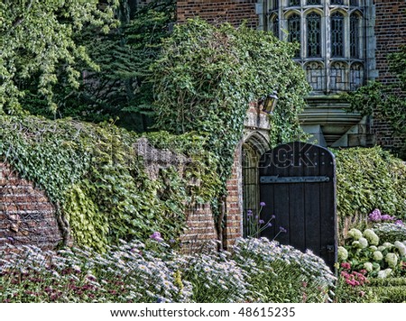 Garden gate stands open for entrance into the secret garden
