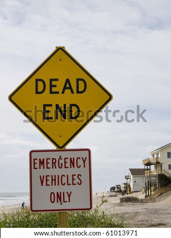 End of the road leading to the beach in Nags Head North Carolina on the Outer Banks. Beach front homes can be seen in the background.