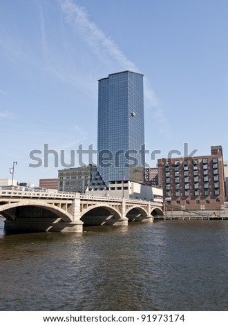 Grand Rapids Michigan USA beautiful downtown with large skyscrapers. The Grand River flows through the town.