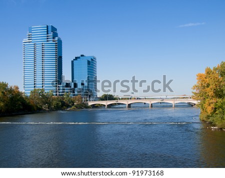 Grand Rapids Michigan USA beautiful downtown with large skyscrapers. The Grand River flows through the town.