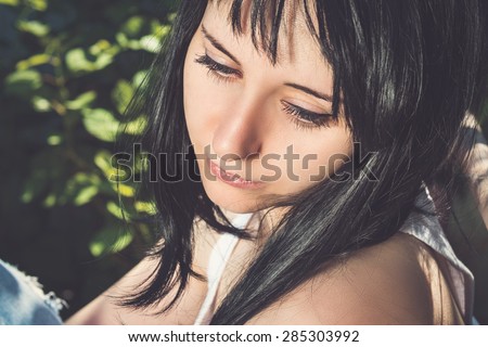 Portrait of beautiful Â sadÂ young sad woman outdoors