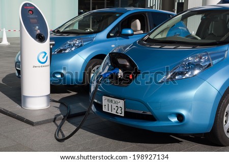 YOKOHAMA, JAPAN - December 4, 2011: A Nissan's electric car 'Leaf' is being charged at the charging station of the company's global headquarters located in Yokohama, Japan.