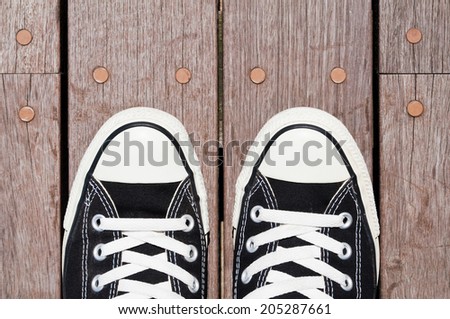 Sneakers on the wood deck