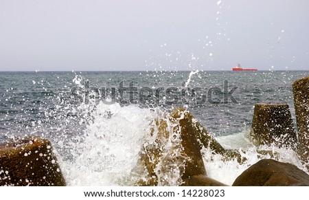 The Sea wave and stone.The Tidal wave is split about stone of the seashore.