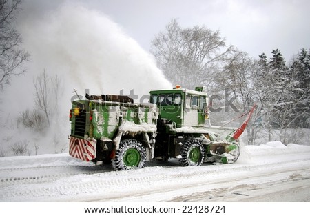 Special technician clears the snow on mountain road.  Island Sakhalin.