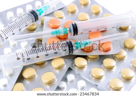 Syringes and tablets. Medical still life.