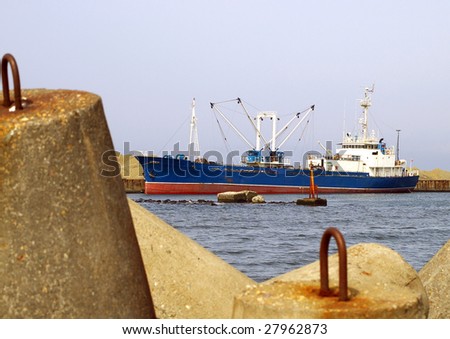 fishing ships beside quay.