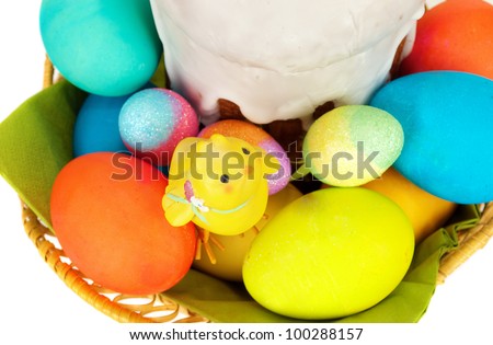 Easter cake with glace icing and colored Easter eggs and little chicken  isolated on the white.