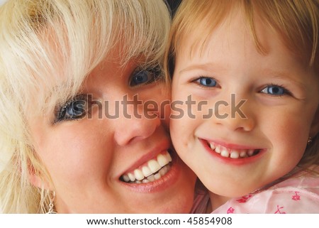 Portrait closeup fro three year old girl and blond mother. Happy family and childhood.