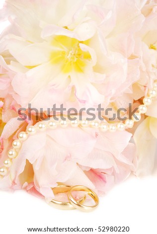 Wedding rings and pink tulips with pearl on white  (wedding invitation card ).