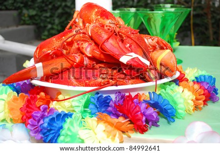 Big red lobsters on the plate for big Hawaii party. Cook food.