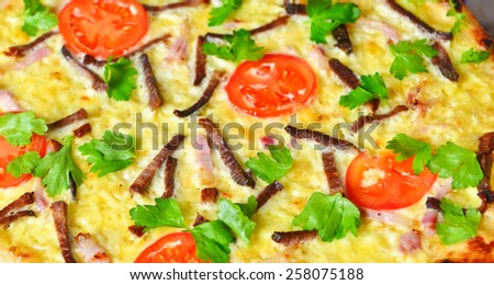 pizza preparation surrounded by ingredients with fresh egg.