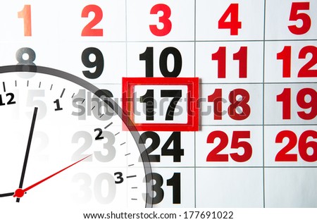 large wall calendar and clock close-up