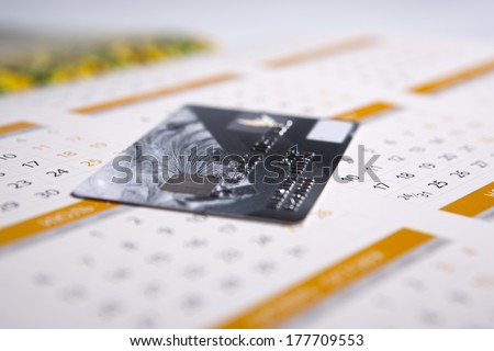 bank card lying on the calendar close-up