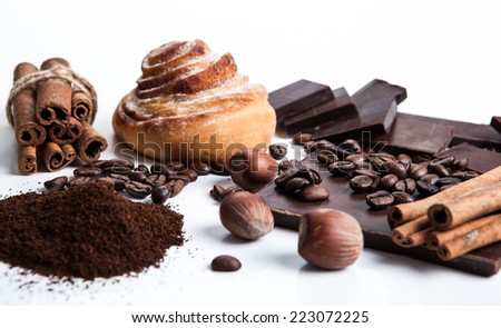 still life of biscuits and chocolate on a white