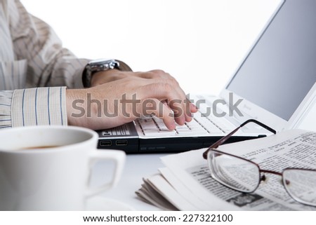 businessman running and a cup of coffee on him desktop
