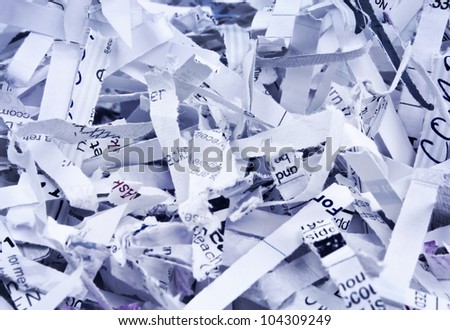 Close up of textured heap of shredded confidential papers with blue overlay with copy space.