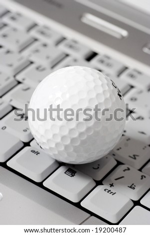 golf ball on a laptop, online gaming concept