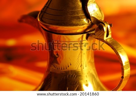 golden arabic tea pot close up