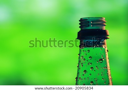 water bottle with water drops on a colorful background