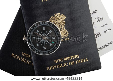 Indian passports magnetic compass and boarding pass isolated on white