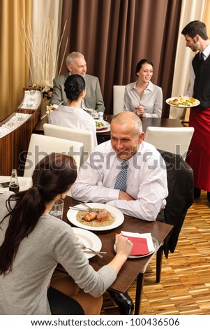 Business people enjoy lunch meal at restaurant management discussion