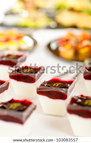 Appetizers mini desserts on catering buffet white tablecloth
