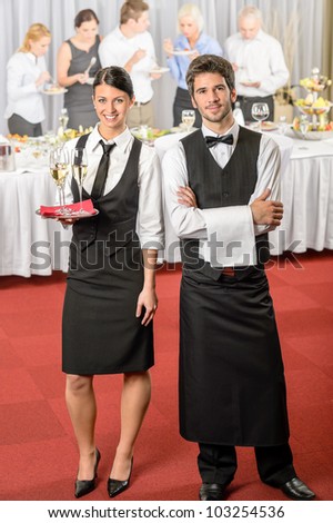 Catering service waiter, waitress business event serving drinks to guests