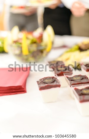 Closeup mini desserts on catering buffet white tablecloth