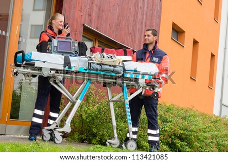 Paramedics emergency home visit call radio ambulance doctor help