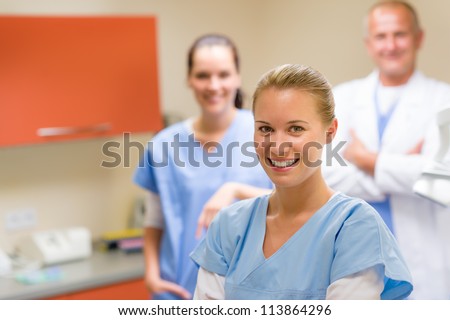 Portrait of smiling medical professional team at the surgery office