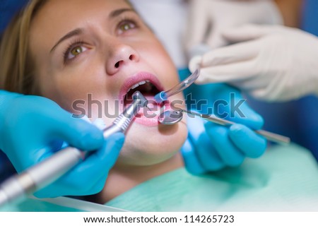 Scared patient at dentist office have teeth checkup closeup mouth