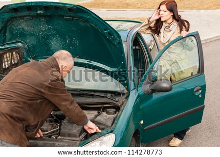 Car breakdown woman calling for road assistance man repair motor
