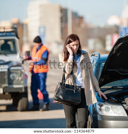 Woman on the phone after car crash breakdown talking upset