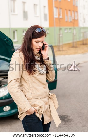 Woman on the phone for car help breakdown accident problem