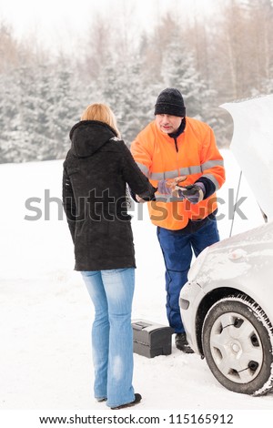 Woman handshake mechanic broken car snow help assistance winter man