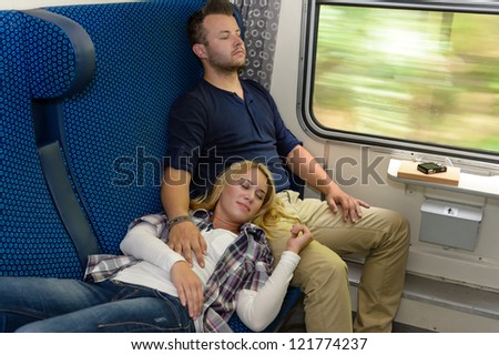 Couple sleeping in train woman man vacation romantic passengers laying