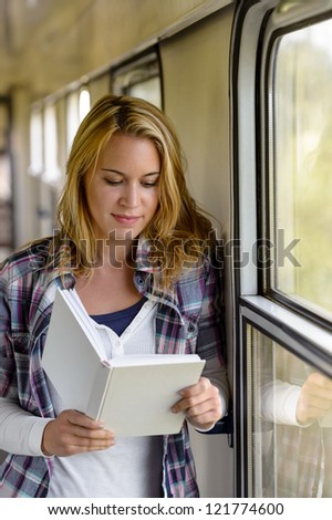 Woman reading book on train hall vacation traveling passenger journey