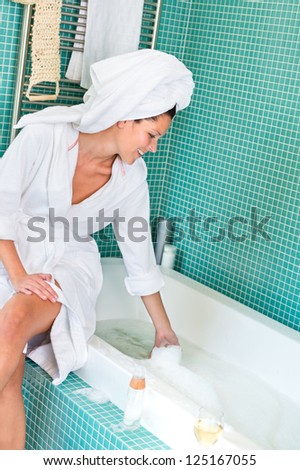 Young woman playing foam bathroom bubblebath home bathrobe hygiene