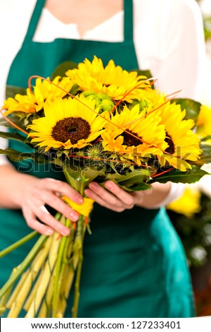 Woman holding bouquet sunflowers florist yellow flower shop