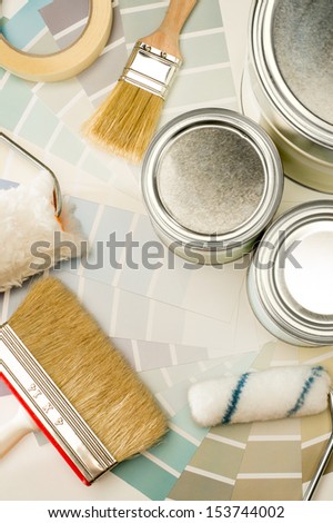 A selection of painting supplies swatch, brush and can