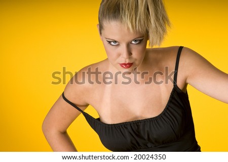 Blond attractive woman with sun tan marks on yellow background