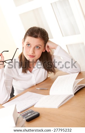 Young brown hair student studying home